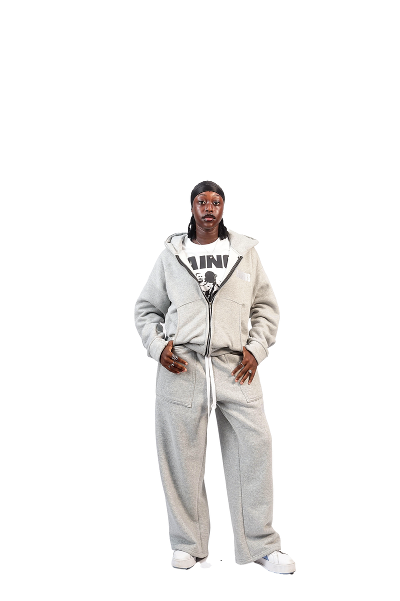 Model wearing the light grey zip-up hoodie with matching wide-leg sweatpants