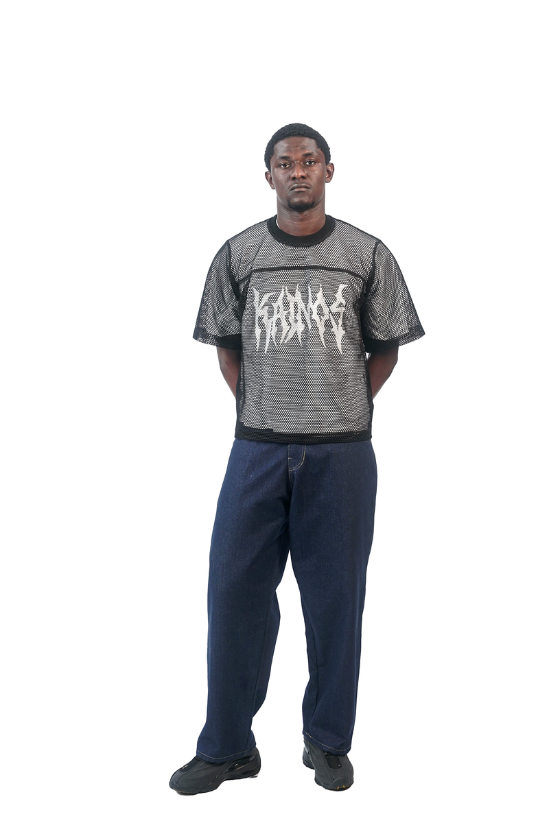 Model wearing the mesh KAINOS T-shirt with navy jeans