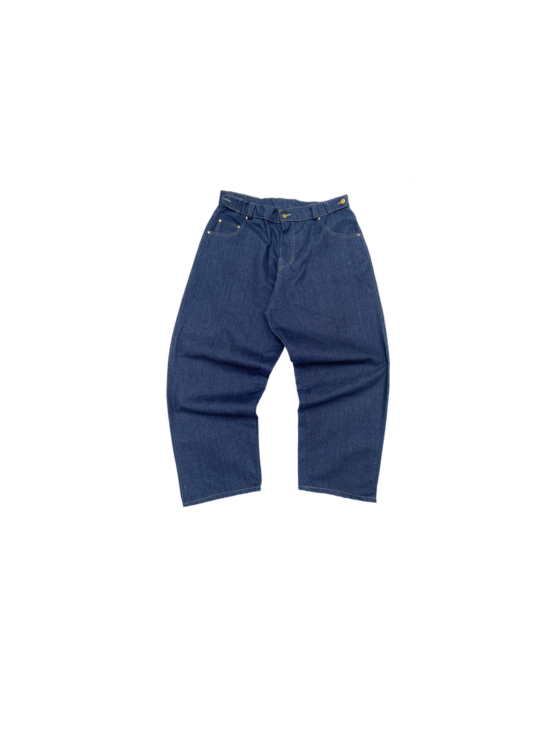 Indigo baggy jeans with a red KAINOS tab at the waistband