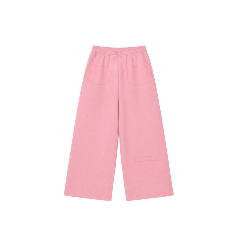 Pink wide-leg cotton sweatpants showing the white KAINOS embroidery